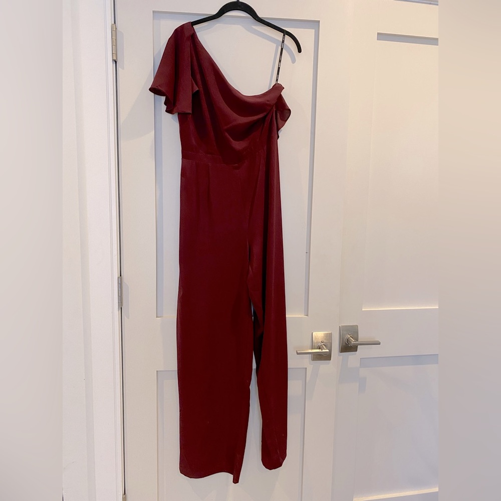 New with tags! One sleeve jumpsuit